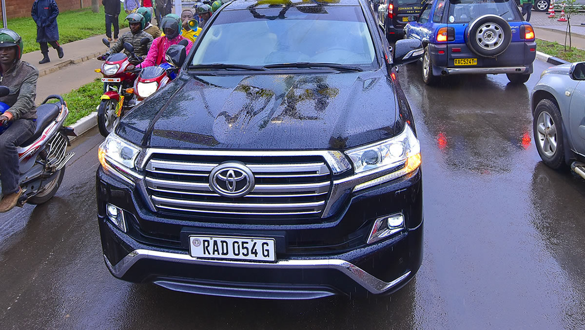 Tourist driving a rental car on a road in Rwanda