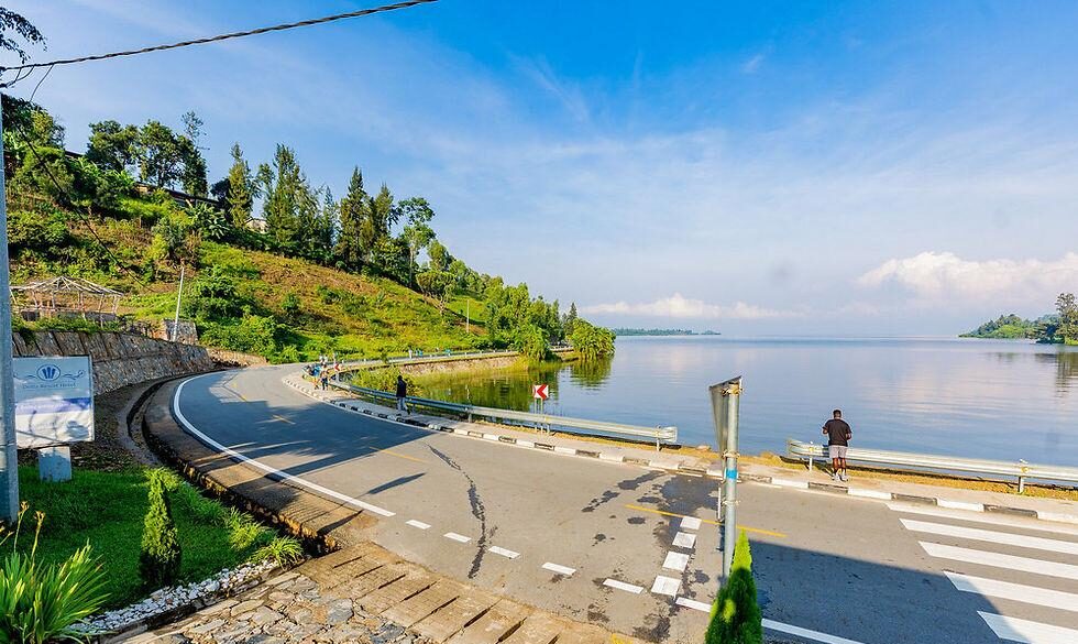 Car travelling from Kigali to Lake Kivu through Rwanda's scenic green hills