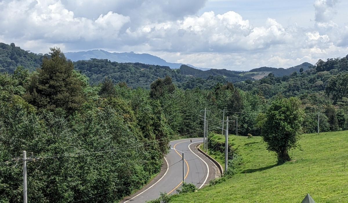 Scenic road through the green hills of southern Rwanda on a trip to Huye