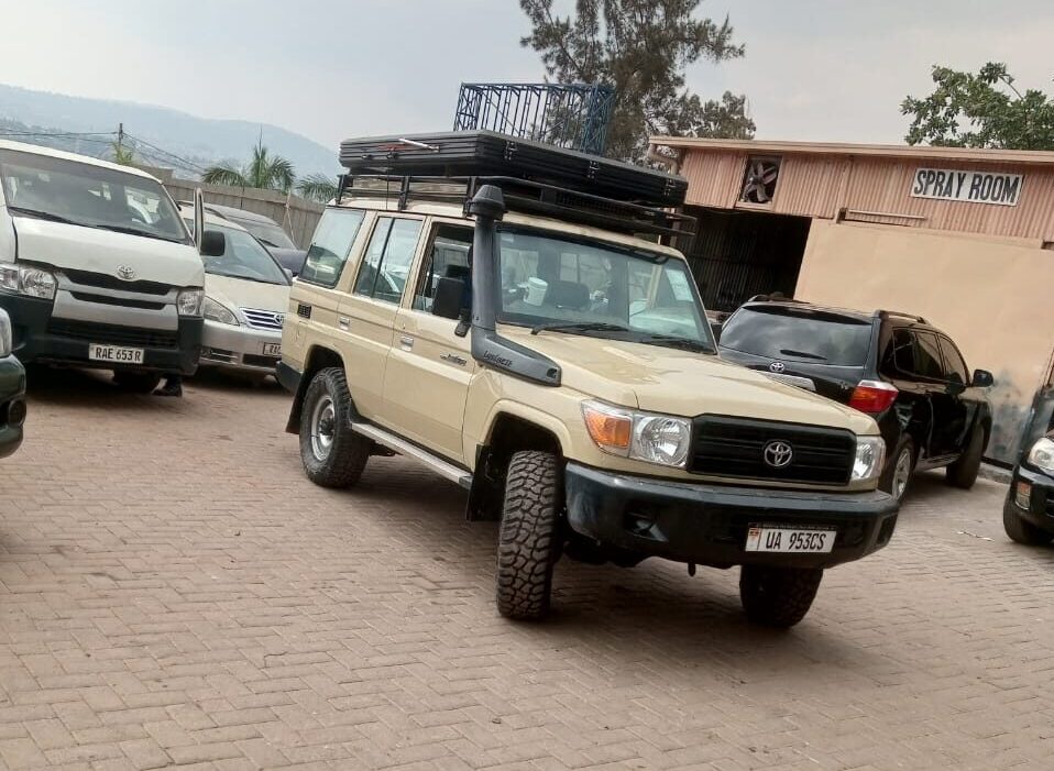 4x4 rental vehicle travelling on a scenic road near Nyungwe Forest National Park in Rwanda
